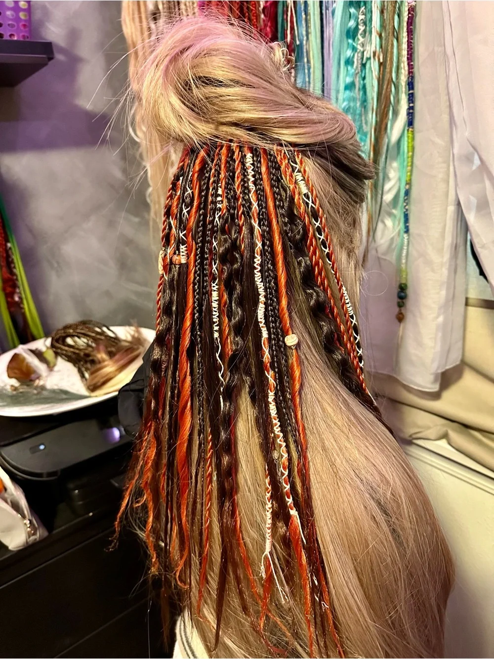 Blonde Hair Extensions with Black and Orange Braided Accents